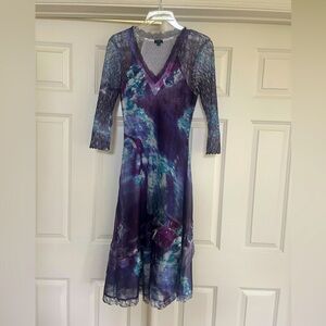 Komarav midi, open weave lace 3/4 length sleeves. Flattering, travels well.